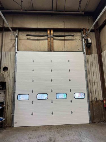 Interior shot of new commercial garage door installation completed by Suppa  Sons Overhead Doors
