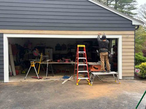 Carpenter from Suppa and Sons Overhead Doors working on a custom replacement garage door frame